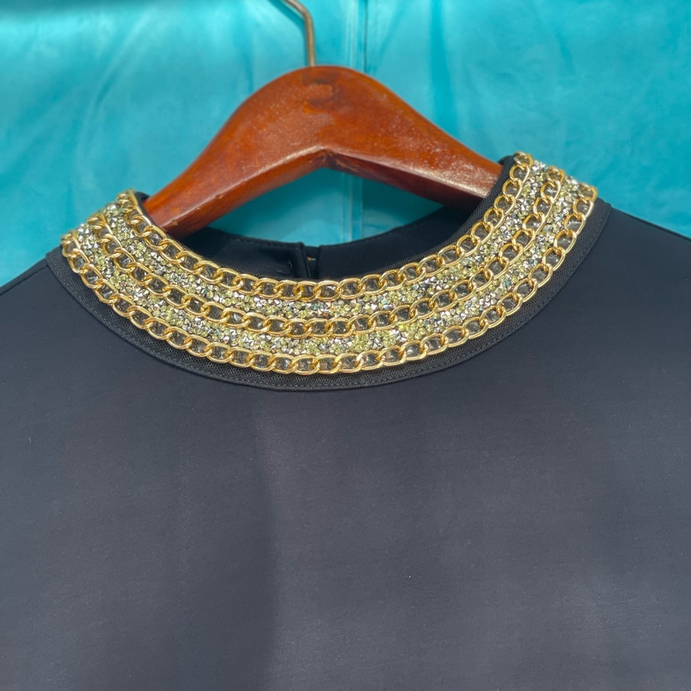 Chic Black Top with Gold Chain Detail